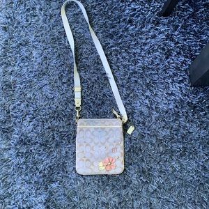 Coach bag champagne color with floral decal